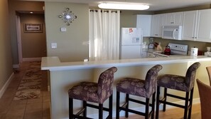Enjoy cooking in this well-equipped kitchen with a central island and ample seating for two.