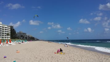 On the beach, sun-loungers