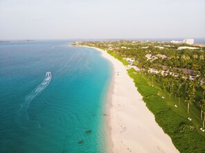 On the beach, sun loungers, beach towels