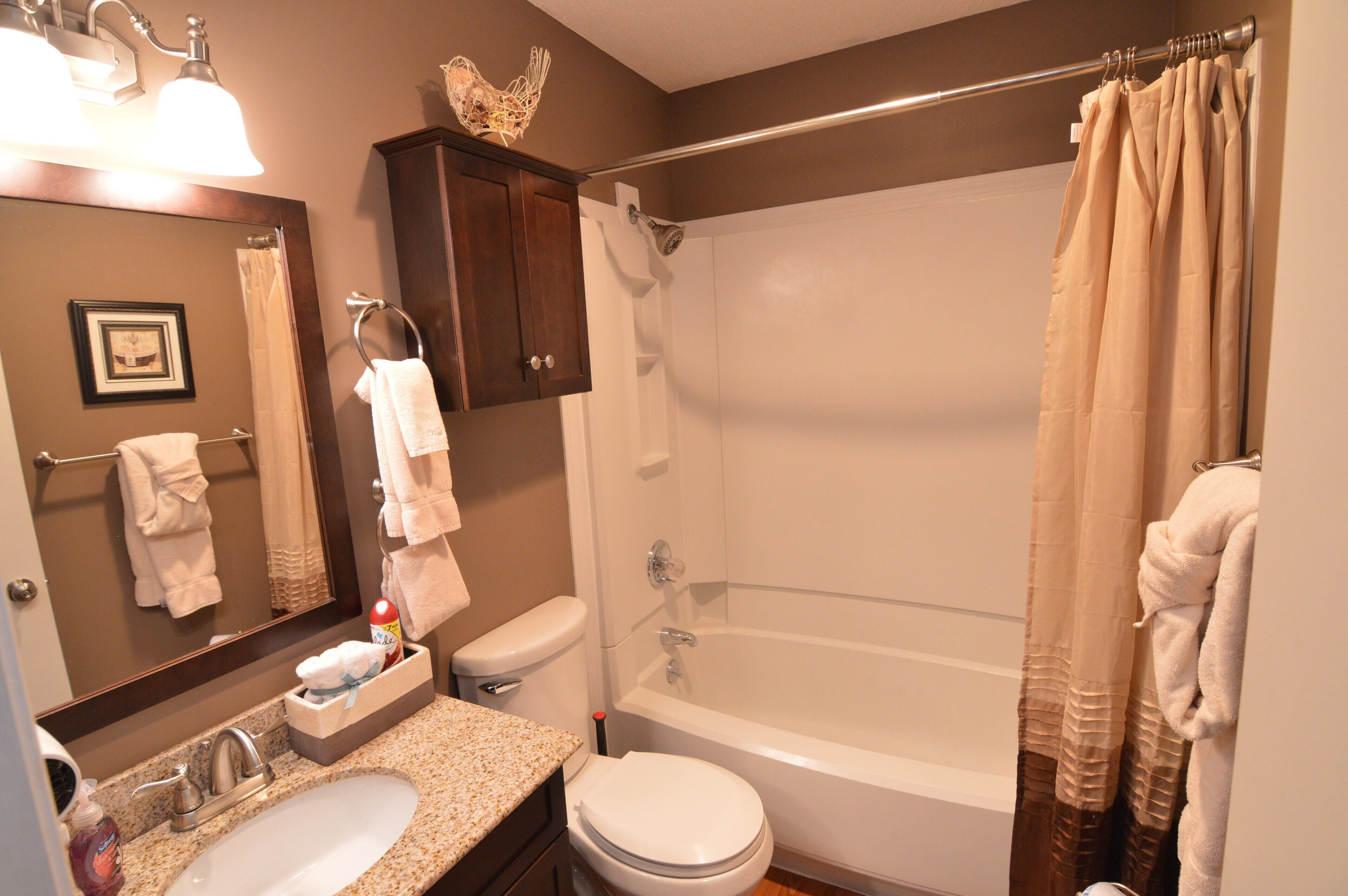 Bathroom...tub & shower, plenty storage, Hair blower, mirror two cabinets...