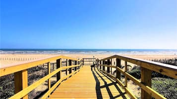 On the beach, sun-loungers