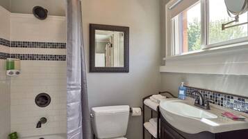 Combined shower/tub, hair dryer, towels, soap