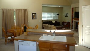 A compact living space with a kitchenette, dining area, and seating area. - Stay In The Heart Of Bend, Walk Everywhere!   (Bend)