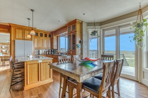 Enjoy meals in this kitchen with a large island, sink, and ample seating for dining.