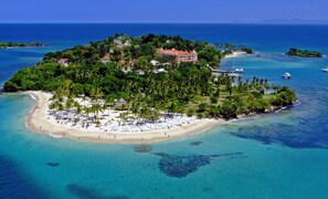 An aerial view of a tropical island with a beach, palm trees, and a few buildings. - We are ON the ocean, high speed WIFI, Just 5 minutes to Las Galeras, Samana (El Frances)