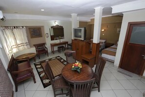 Studio | Living area | 21-inch LED TV with cable channels, TV, pay films - Hotel Mataram Malioboro (Yogyakarta)