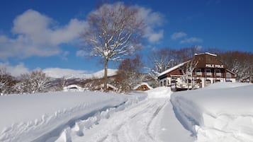 A snow-covered landscape with a building labeled "POLE POLE" and a clear blue sky.
