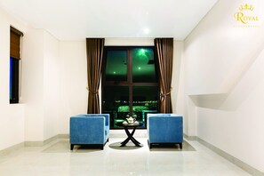 Habitación Deluxe | Minibar, caja fuerte, escritorio y sistema de insonorización