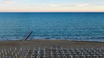 Private beach, white sand, sun loungers, beach umbrellas