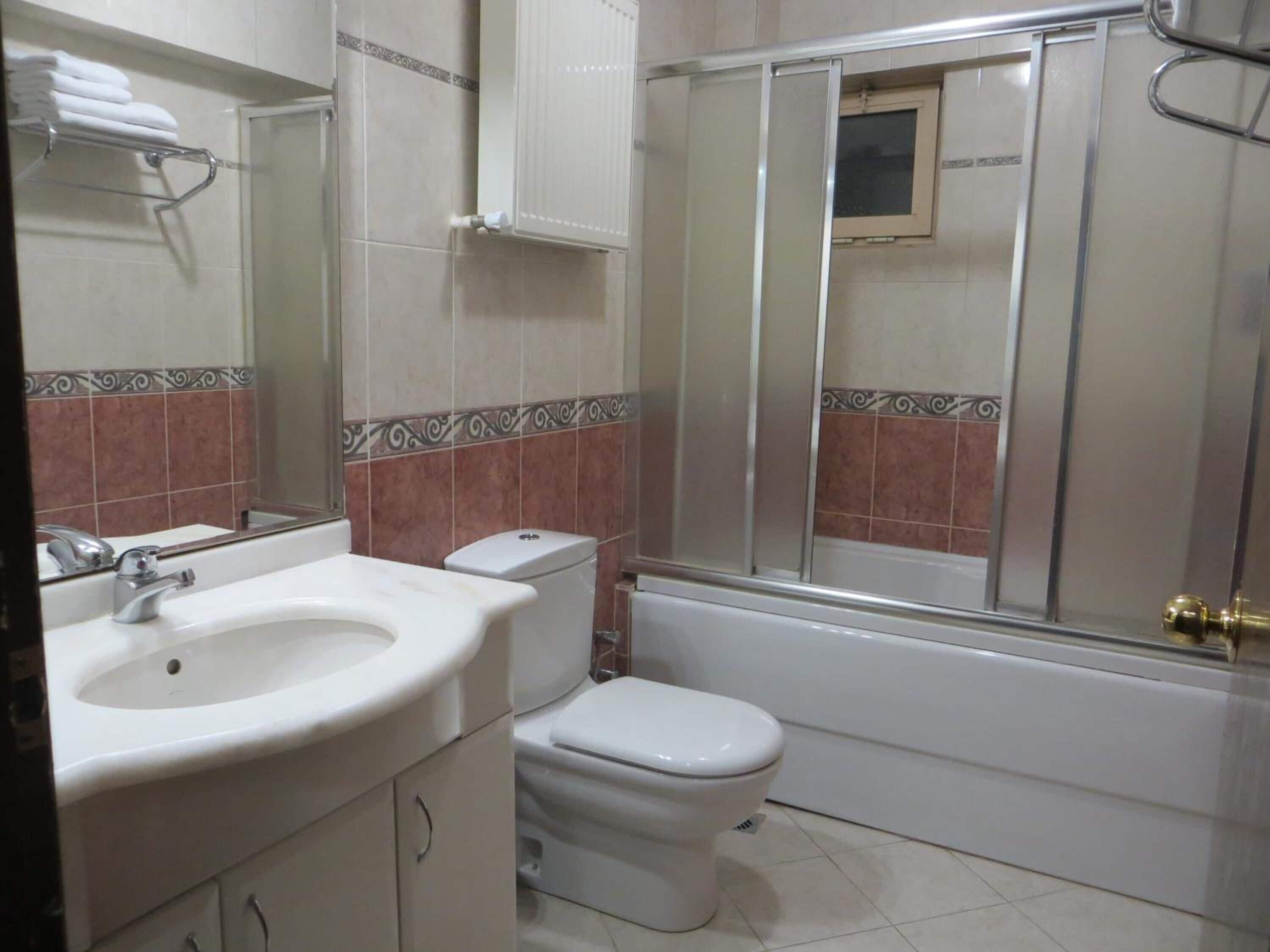 bathtub, free toiletries, hair dryer, slippers