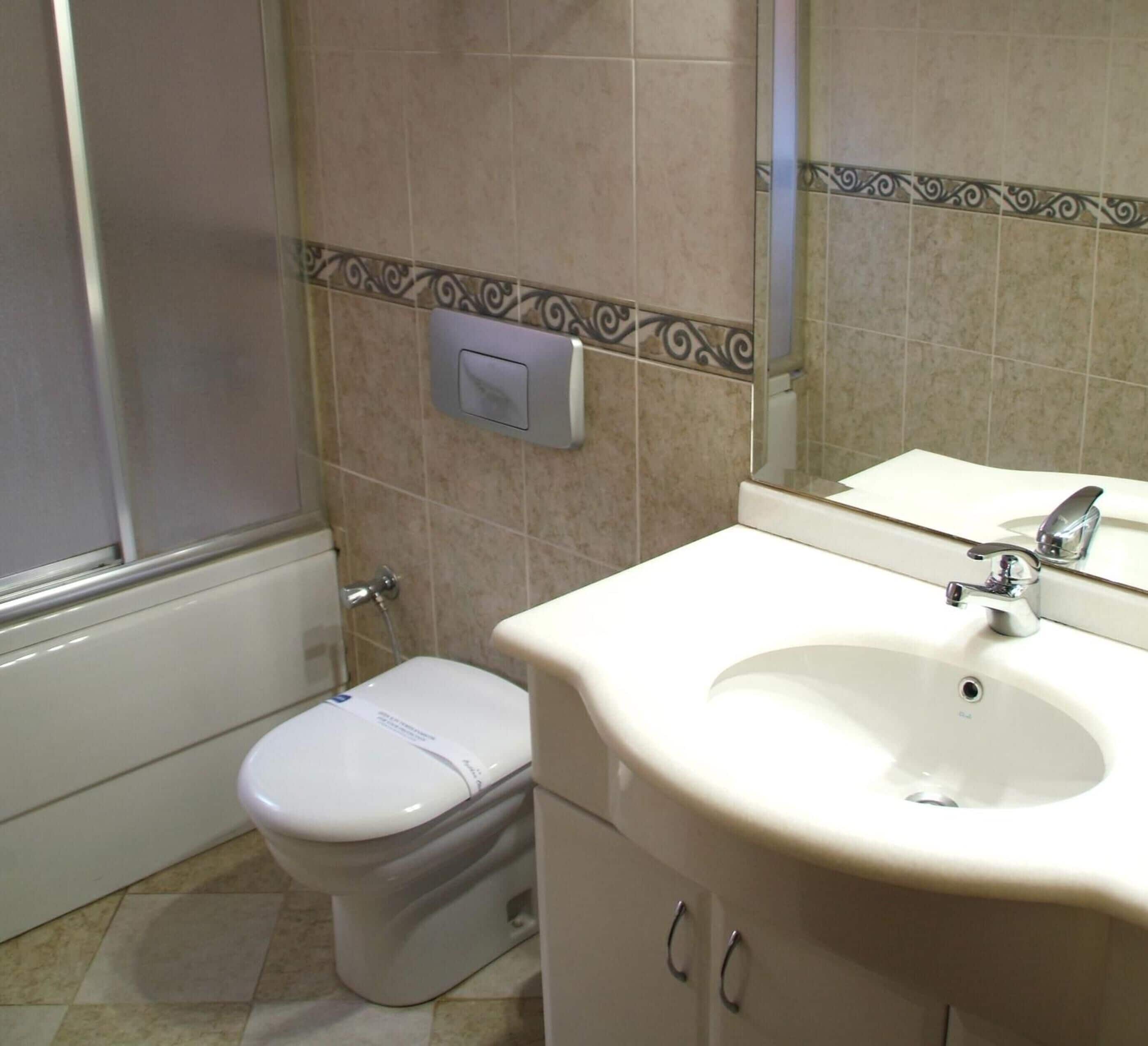 bathtub, free toiletries, hair dryer, slippers