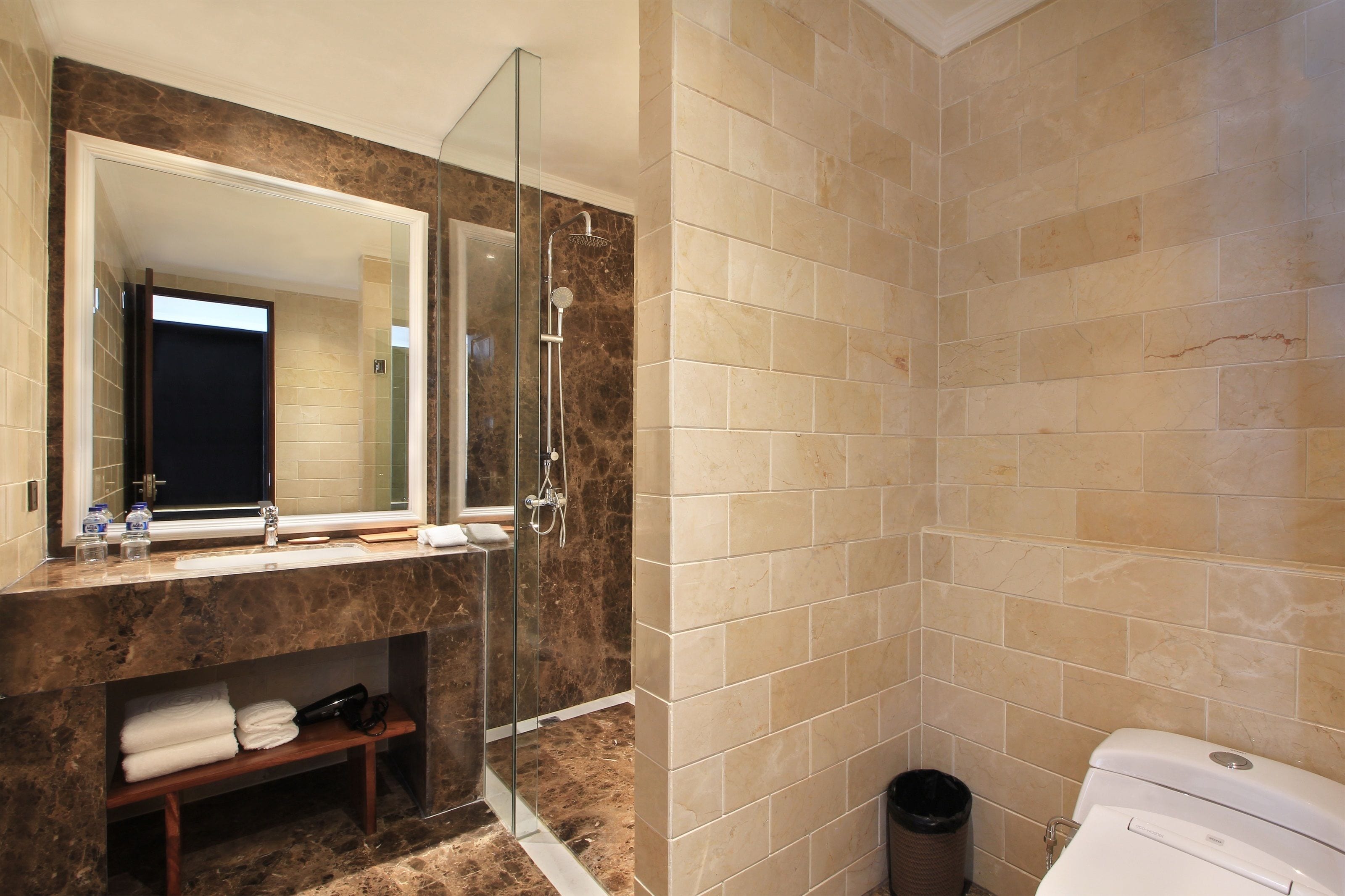 shower, hair dryer, slippers, towels