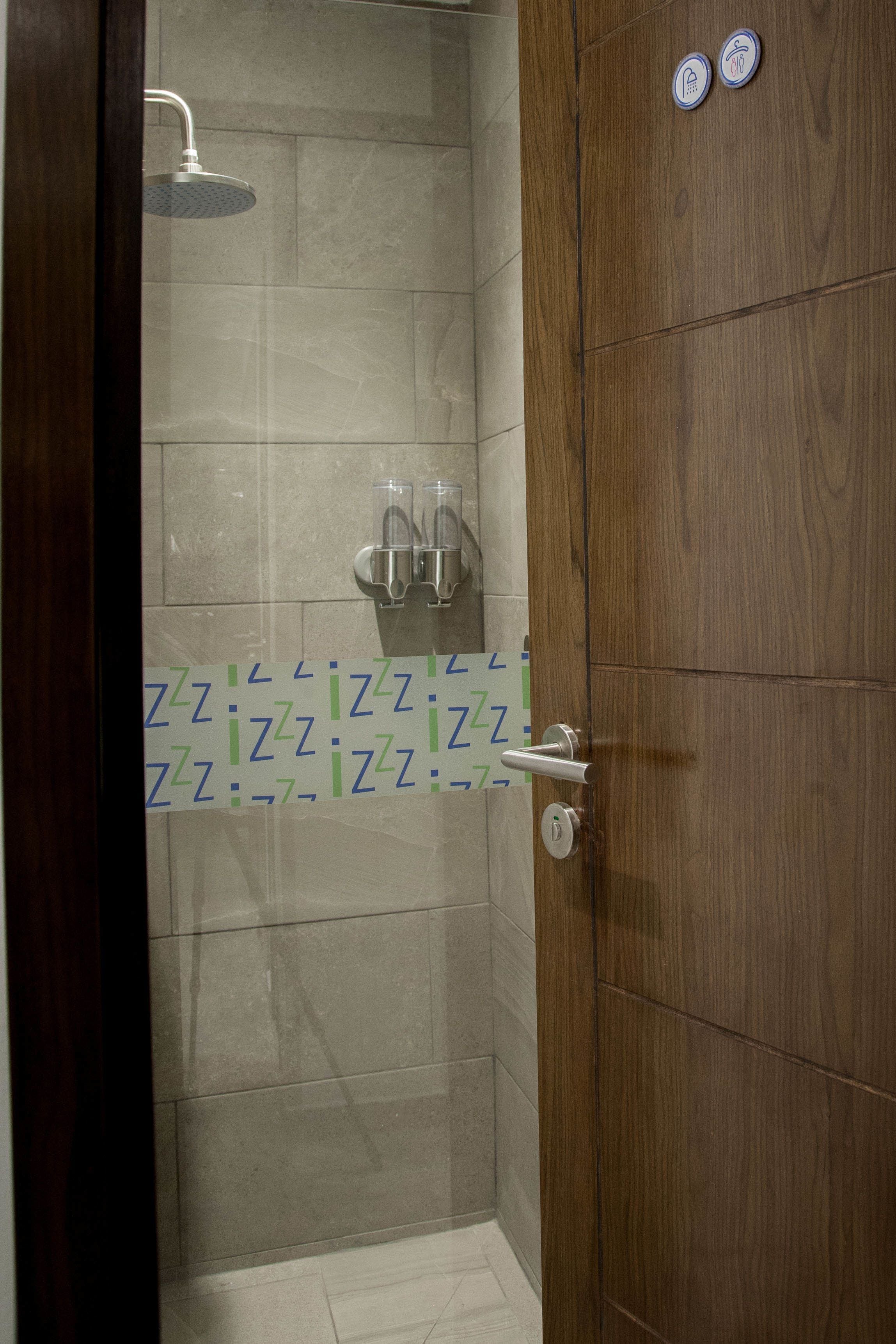 comfort capsule in mixed dorm | bathroom shower