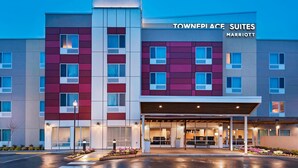 A modern hotel with a prominent sign reading "Townfield Suites Marriott". - TownePlace Suites by Marriott Tacoma Lakewood (Lakewood)