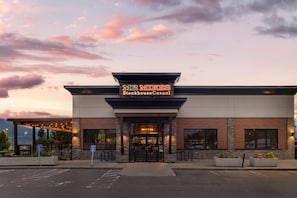 A steakhouse with a modern facade, a clear entrance, and a parking area with handicapped accessibility. - Best Western Plus Merritt Hotel (Merritt)