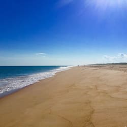 On the beach, sun-loungers, beach umbrellas, beach towels
