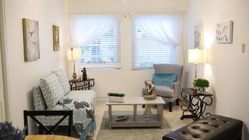 Deluxe Apartment, 1 King Bed, Terrace, Garden Area | Living room | Flat-screen TV