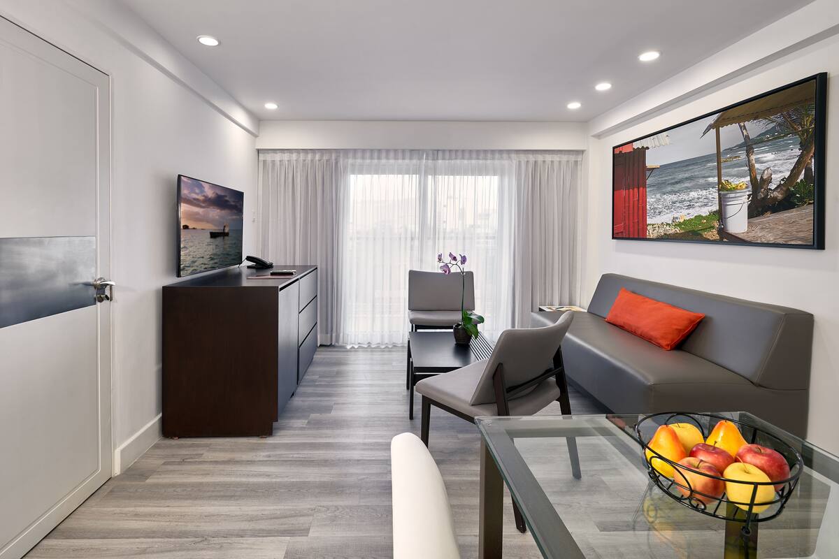 two bedroom penthouse loft suite with balcony and kitchenette | living area | 40-inch smart tv with cable channels, tv