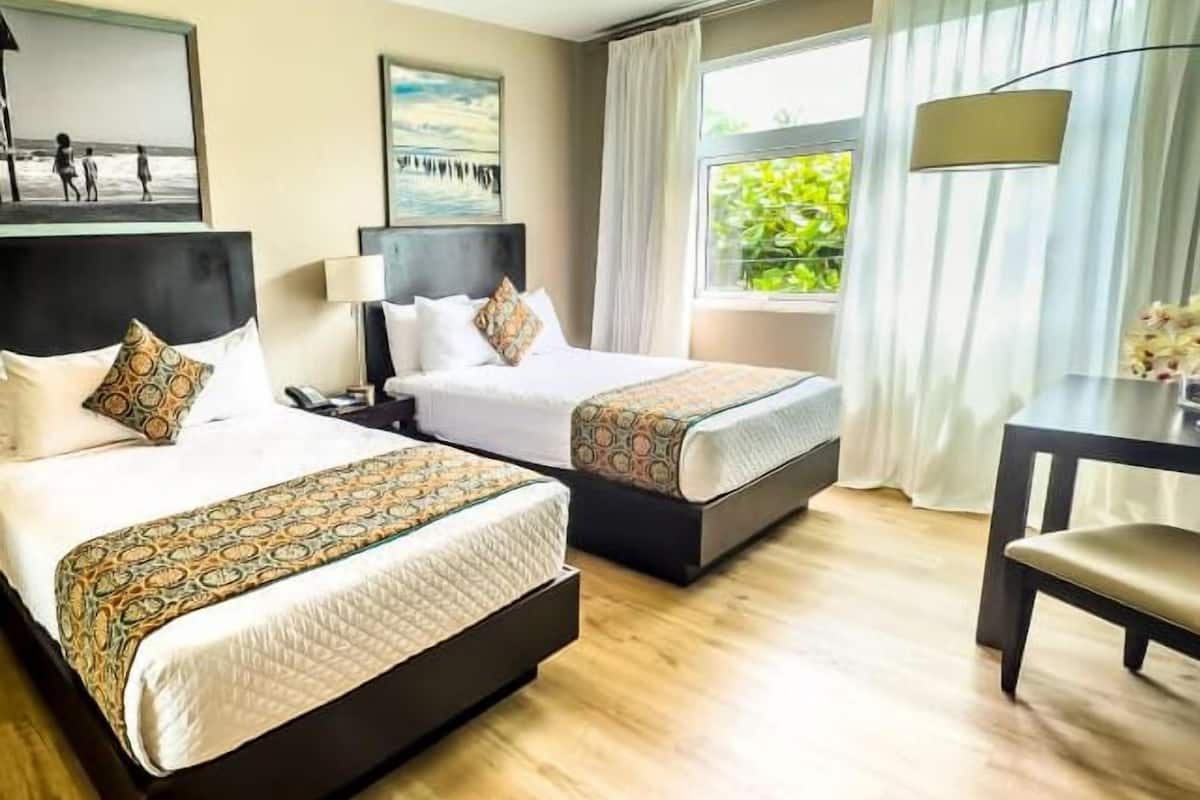 deluxe room, 2 double beds, kitchenette | 1 bedroom, in-room safe, individually decorated, individually furnished