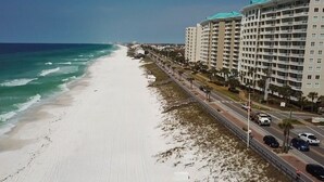 A beachside hotel with multiple floors, a road adjacent to the beach, and ocean views. - Costa del Mar - 1 Br Condo (Miramar Beach)