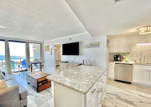 Condo, 2 Bedrooms, Balcony, Beachfront (202) | Private kitchen | Full-size fridge, microwave, oven, stovetop - Island Winds East by ALBVR (Gulf Shores)