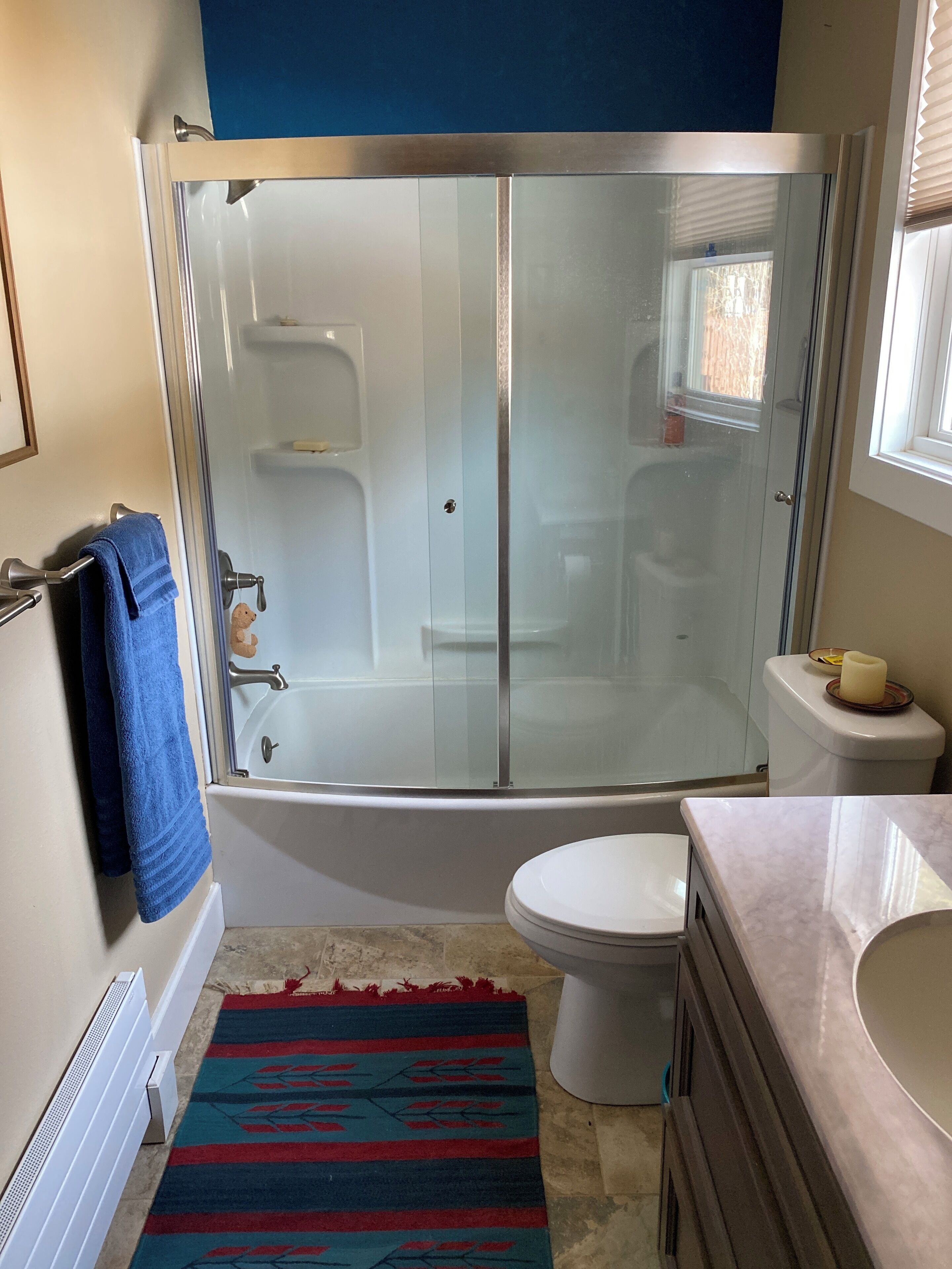 Combined shower/tub, hair dryer, towels, soap