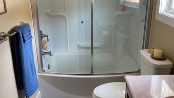 Combined shower/tub, hair dryer, towels, soap