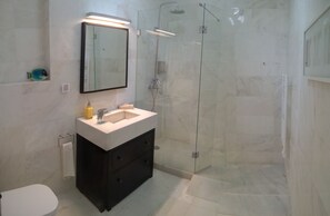 Shower, hair dryer, towels, soap