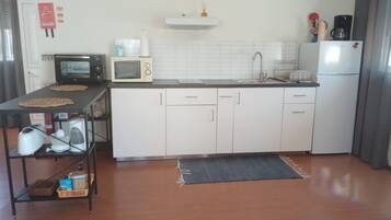 Fridge, microwave, stovetop, coffee/tea maker
