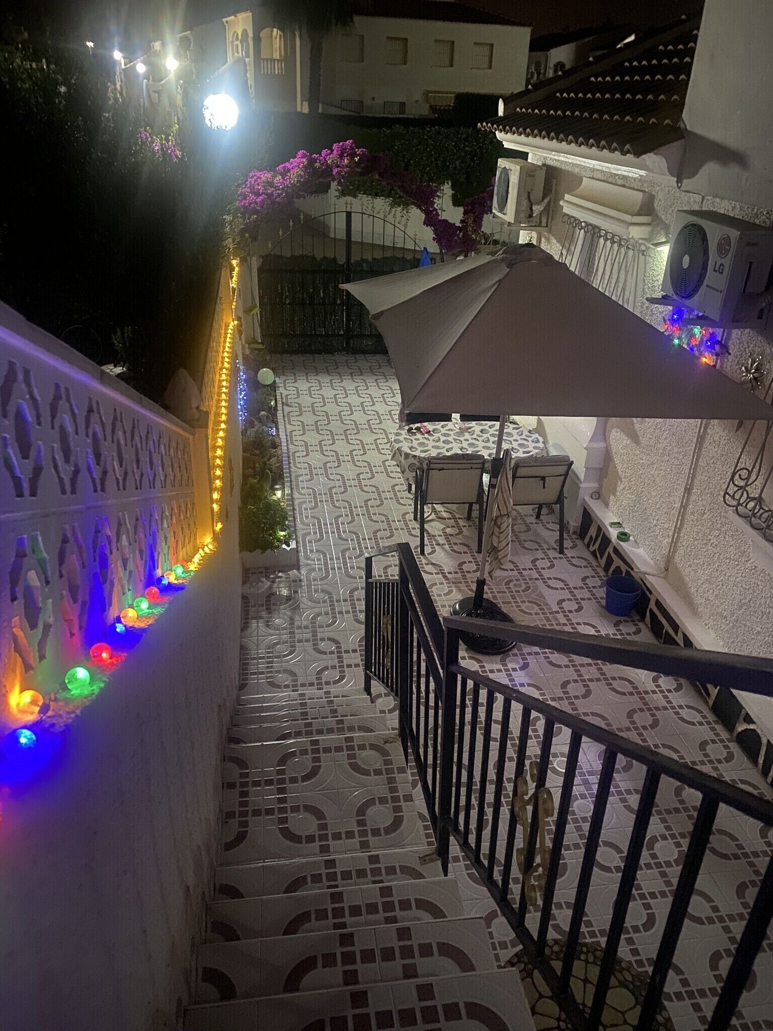 Lower terrace border garden plants and well lit with solar lights 