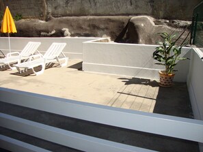 A pool area with white lounge chairs and a yellow umbrella. - Aracelli T2 apartment with terrace and balcony.  (Ermesinde/Porto)