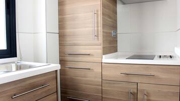 Fridge, microwave, stovetop, coffee/tea maker