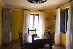 Dining room with windows overlooking the swimming pool