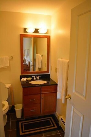 Bathtub, jetted bath, hair dryer, towels