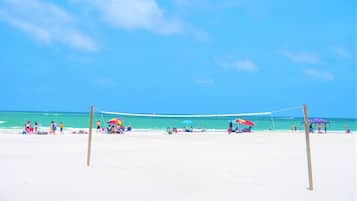 On the beach, sun-loungers, beach towels