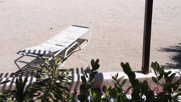 On the beach, sun loungers, beach towels