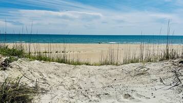 On the beach, sun loungers, beach towels