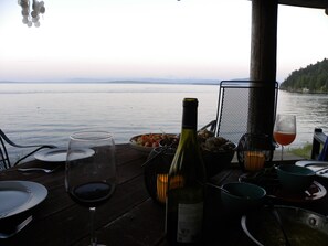 Outdoor dining - Historic lodge, new wing, ocean-front, private beach, kayaks, hot tub, and more! (Eastsound)