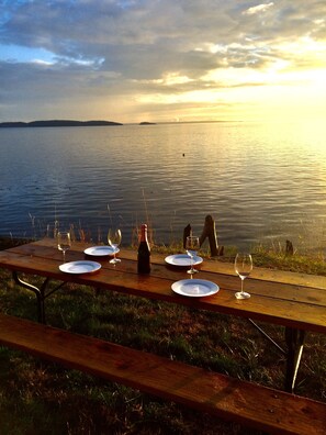 Outdoor dining - Historic lodge, new wing, ocean-front, private beach, kayaks, hot tub, and more! (Eastsound)