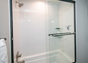 Combined shower/tub, hair dryer, towels, soap