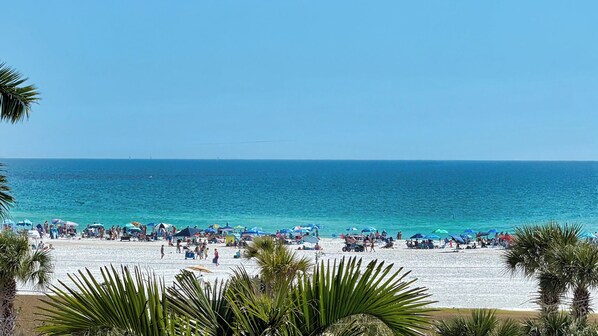 On the beach, sun-loungers
