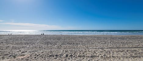 On the beach, sun loungers, beach towels