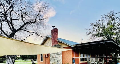 5 BR family ranch home, near Fossil Rim, hiking, farm animals and COWBOY POOL