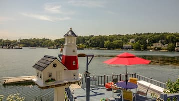 Enjoy waterfront views from the lighthouse and adjacent cottage, perfect for relaxation.