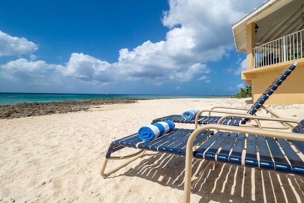 On the beach, sun-loungers, beach towels