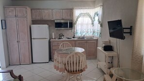 Fridge, microwave, stovetop, coffee/tea maker