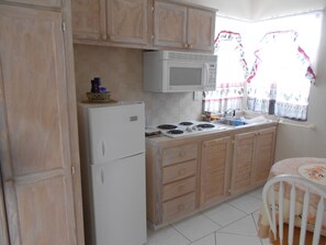 Fridge, microwave, stovetop, coffee/tea maker