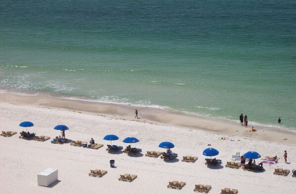 On the beach, sun-loungers