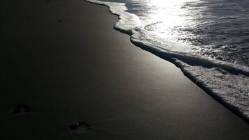 On the beach, sun loungers, beach towels
