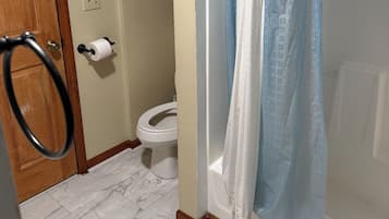 Combined shower/tub, hair dryer, towels, soap